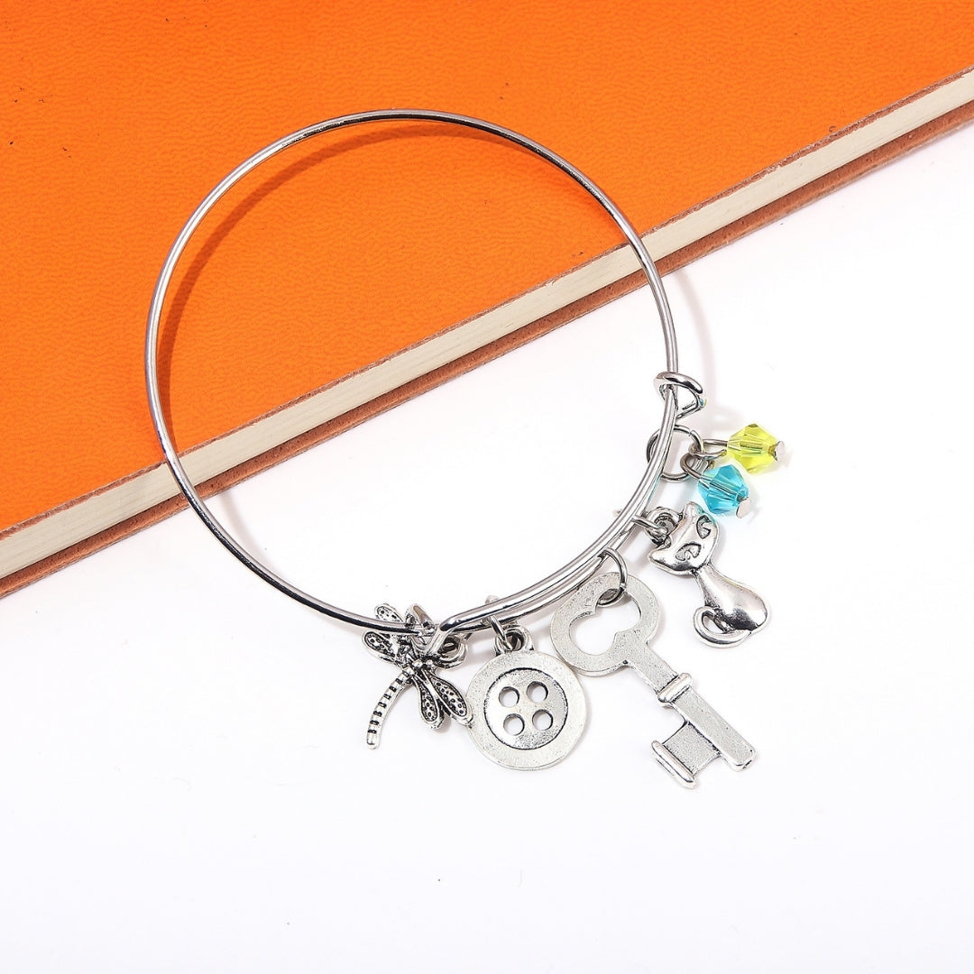 Pulsera De Aro Con Dijes Coraline - Coraline