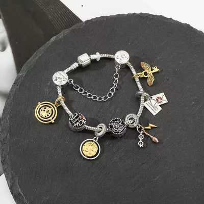 Pulsera Con Charms Harry Potter (Giratiempos) - Harry Potter